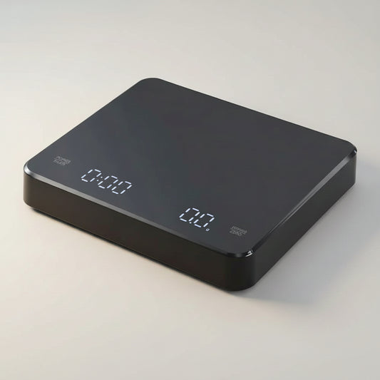 Powered on coffee digital scale on white background with a USB-C cable.